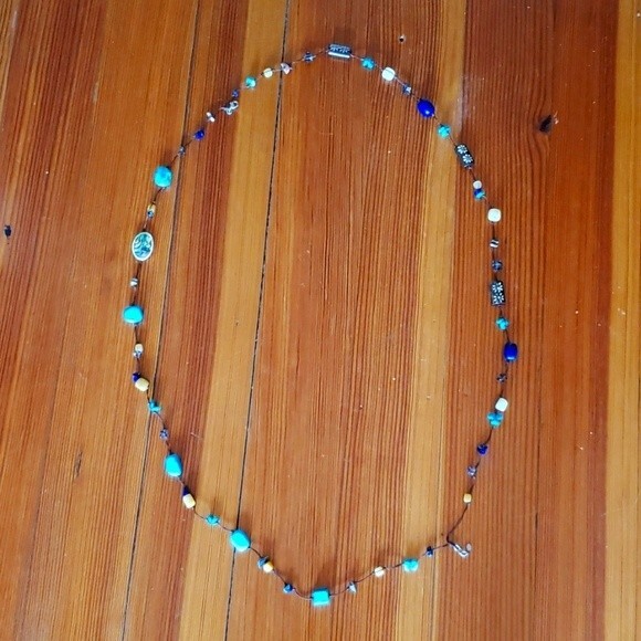 Very long Turquoise stone/bead necklace. Colors are Blue, Brown, Cream. - Picture 2 of 3